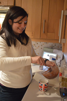 Pouring the cake batter into the mug 