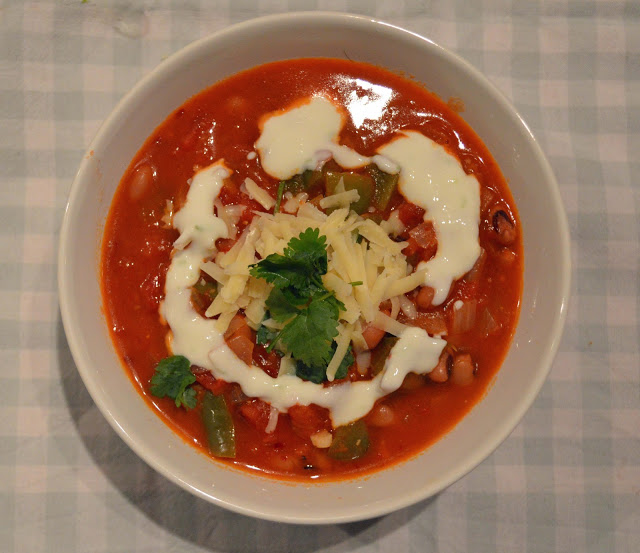 Smoky Black Bean Soup with fresh coriander garnish