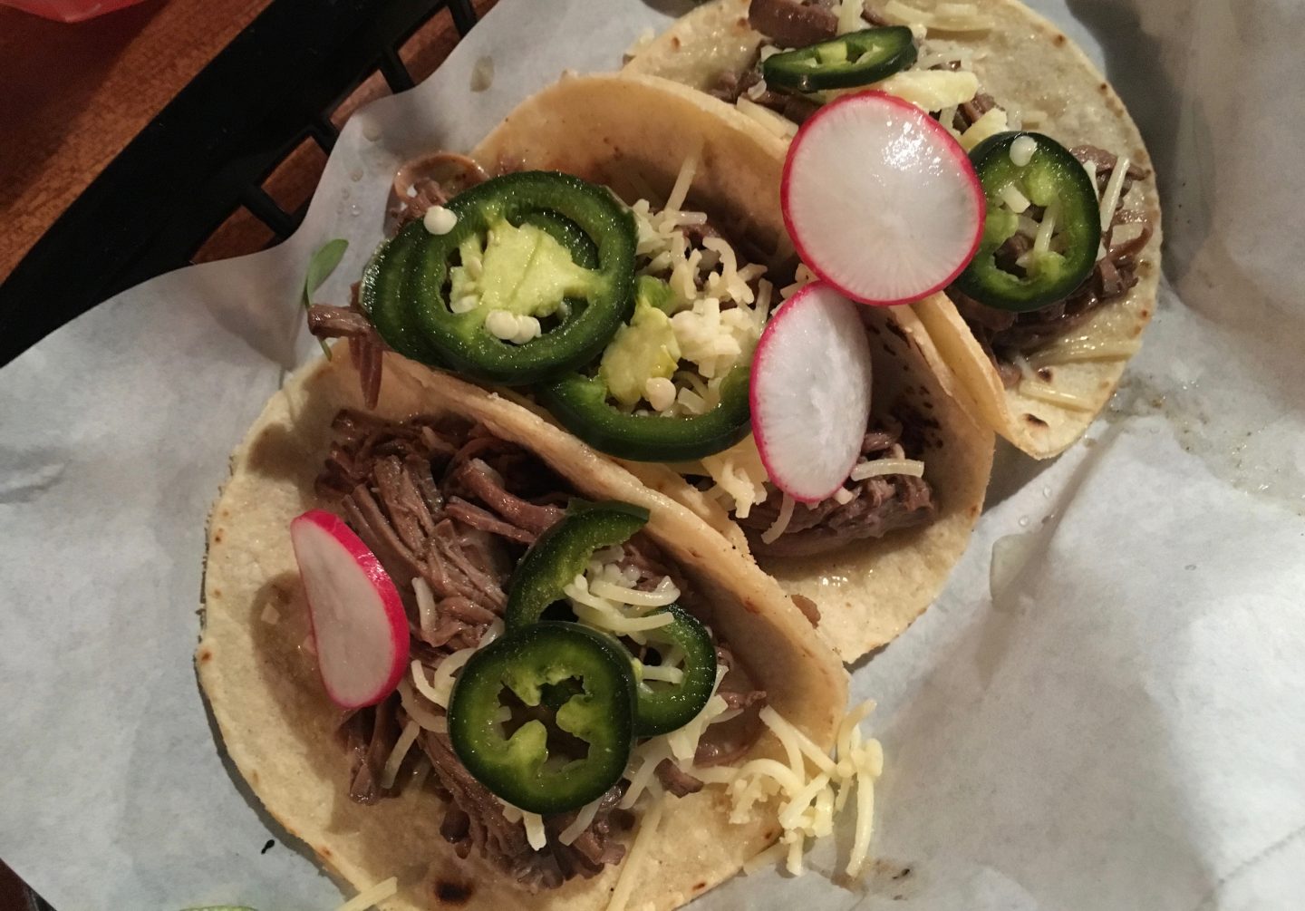 Beef brisket taco with cheddar and green jalapeños 